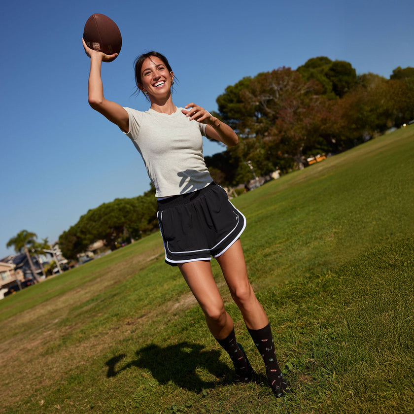 Socks that Support Youth Sports: Black Footballs