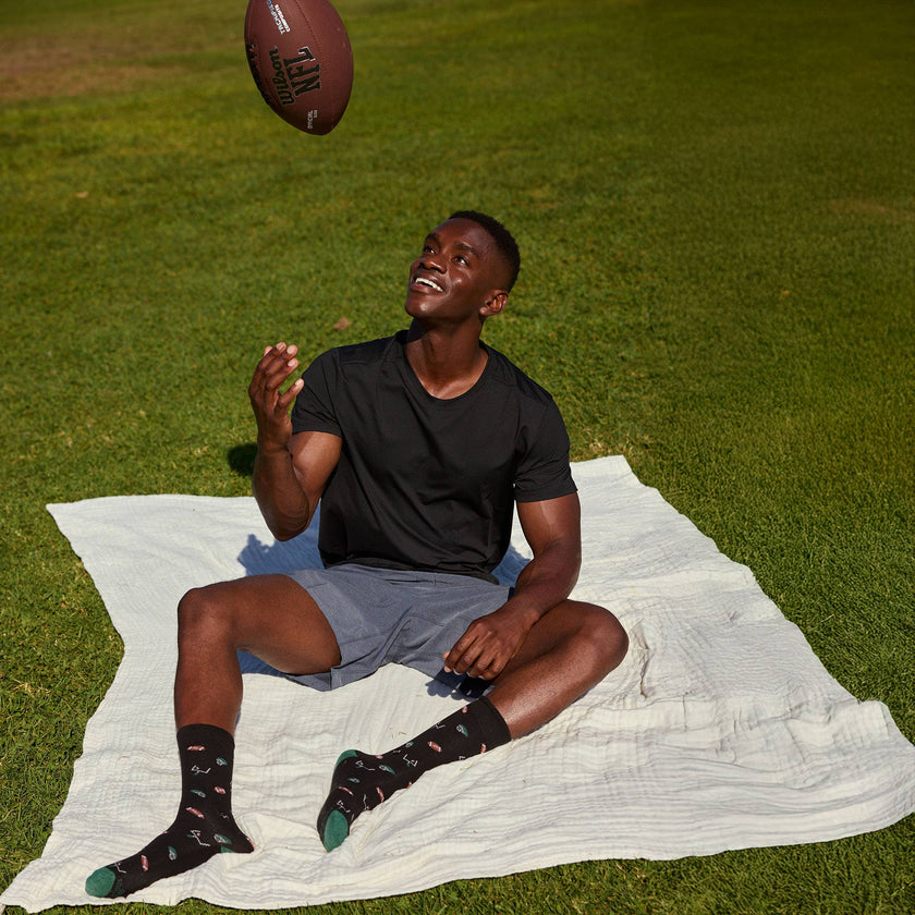 Socks that Support Youth Sports: Black Footballs